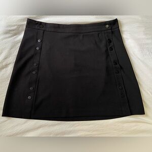 Reitman’s Black Mini Skirt with Button Detail- Size 16